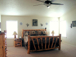 The master bedroom. The 70 inch ceiling fan has its own remote.
