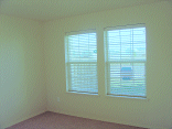 The front of the living room with blinds.